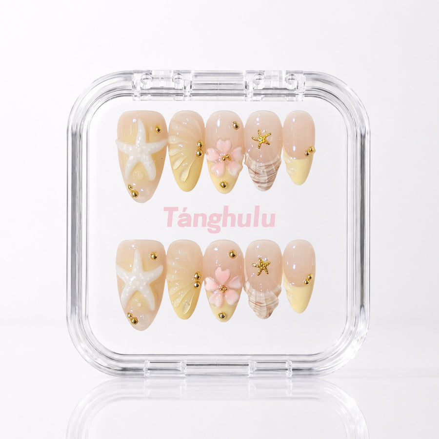 Golden Shore — Medium Almond press-on nails aligned vertically with level cuticle edges in a Tanghulu acrylic case