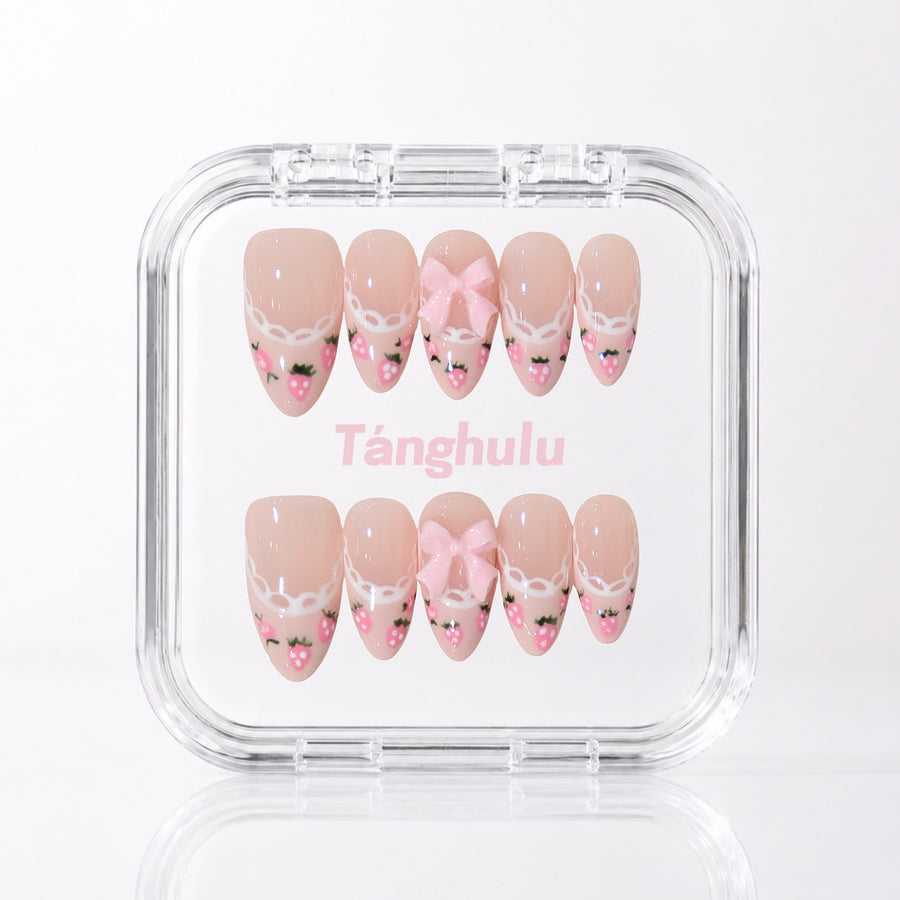 Berry Bow — Medium Almond press-on nails in Tanghulu acrylic case