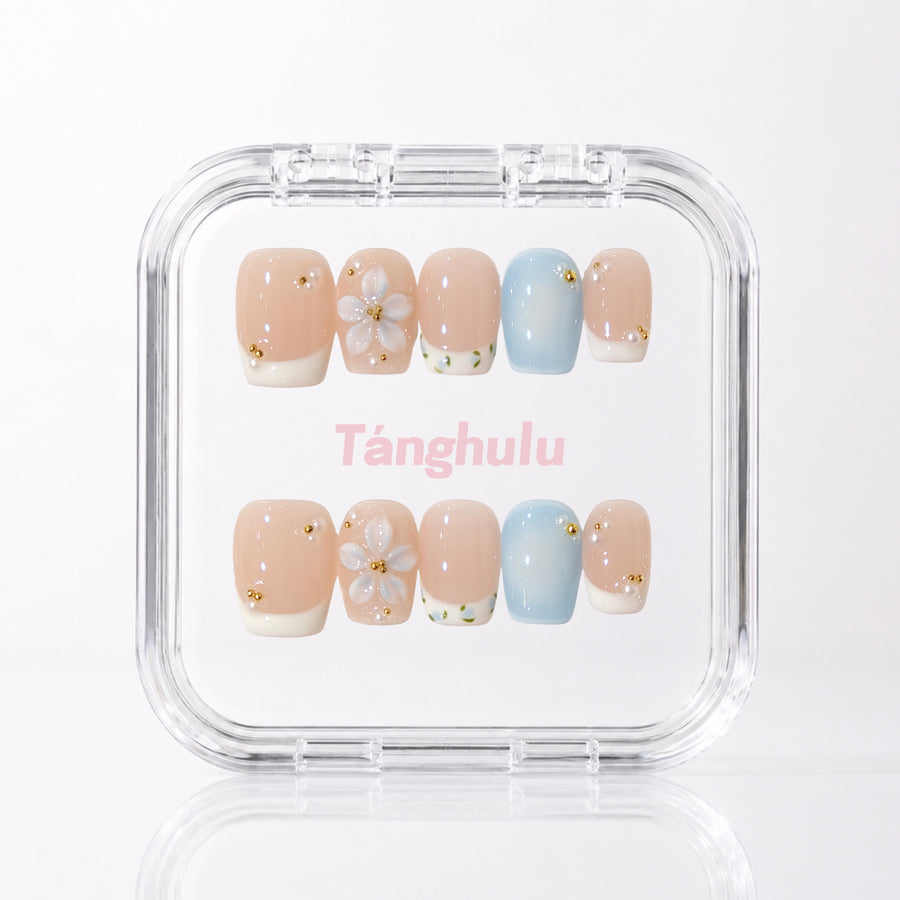 Blue Whisper — Short Coffin press-on nails aligned vertically with level cuticle edges in a Tanghulu acrylic case