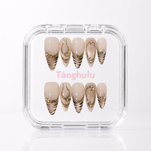 Golden Tiger — Long Stiletto press-on nails with gold tiger-stripe tips and crystals in a Tanghulu acrylic case